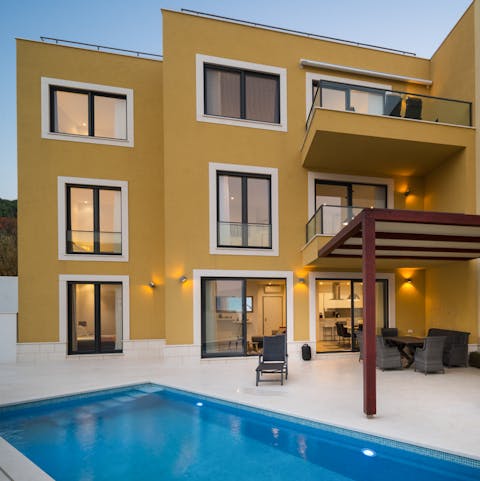 Enjoy a twilight swim in the private pool, floating underneath the starry sky