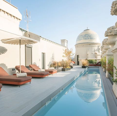 Plunge into the communal rooftop pool