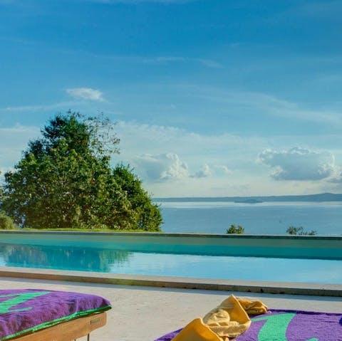 Swim gentle laps in the infinity swimming pool