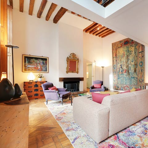 Admire the antique tapestry in the beautiful living space