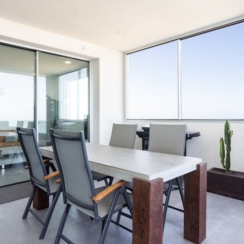 Gather together for an alfresco barbecue on the shaded terrace