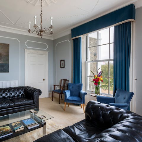 Relax in the large living room and marvel at the period mouldings.