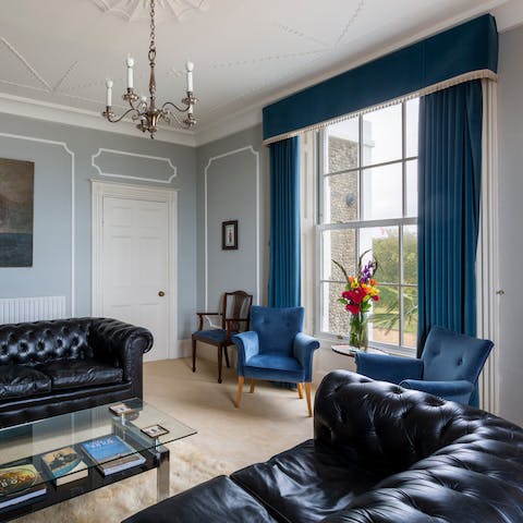 Relax in the large living room and marvel at the period mouldings.