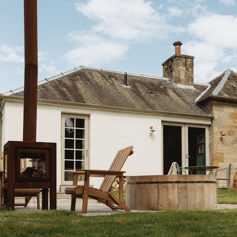 Soak in the cedar hot tub as you enjoy your peaceful surroundings