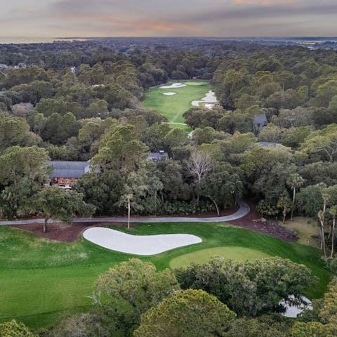 Play around or two on the nearby golf course