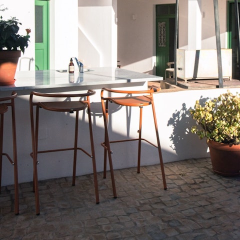 Take a seat around the outdoor bar and bond over a few drinks