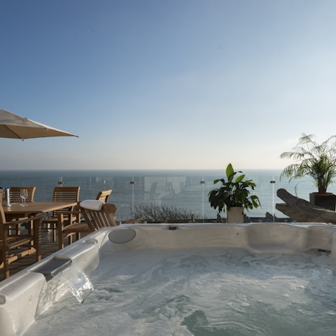 Relax and unwind in the luxurious hot tub with marvellous views