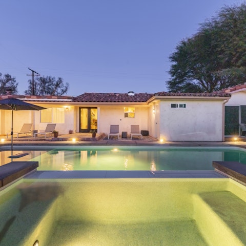 Unwind in the hot tub as the sun starts to set