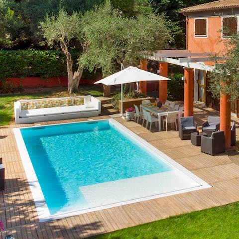 Sit poolside with a morning coffee as your feet dangle into the cool water