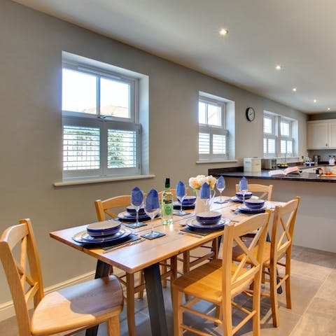 Gather around the dining table for family homecooked meals, drinks, and board games