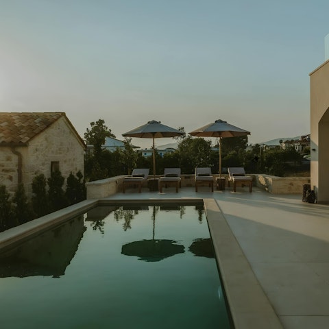Relax by the pool when you're not busy at the nearby beach