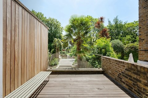 Step out onto the terrace into a lush garden