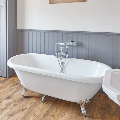 Soak in the luxurious Victorian rolltop clawfoot tub after a long day of exploring