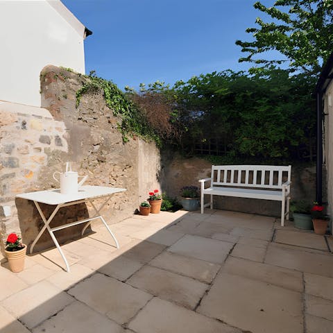 Enjoy quiet evenings sipping G&Ts in the garden