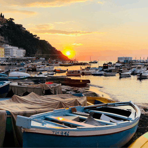 Watch the sunset from the Grand Marina of Sorrento, located closeby