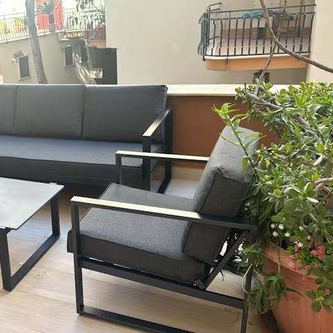 Enjoy coffee or cocktails on the private balcony