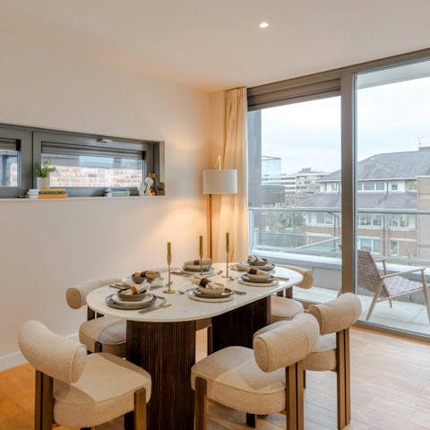 Open the balcony doors beside the dining table