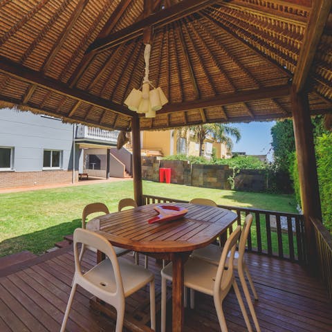 Treat yourself to a café con leche in the Hawaiian-style gazebo