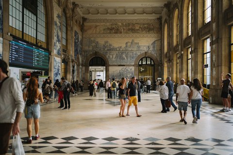 Marvel at São Bento Station's extraordinary 20,000-panel azulejo tile murals, an ten-minute walk away