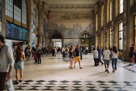 Marvel at São Bento Station's extraordinary 20,000-panel azulejo tile murals, an ten-minute walk away