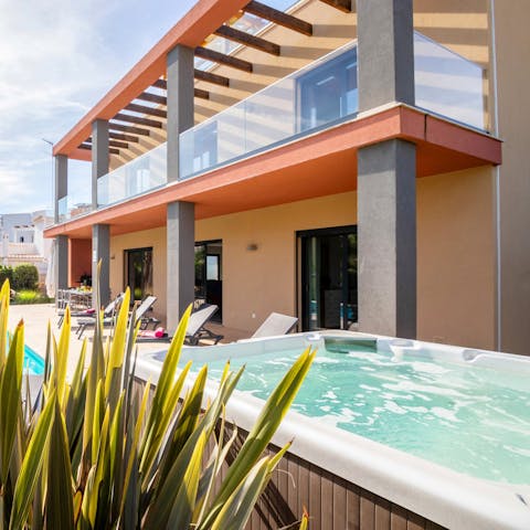 Slip into the hot tub to relax after a day of exploring