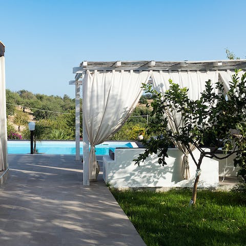 Sip negronis beneath the shaded pergolas on your terrace