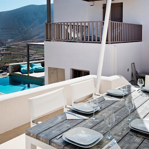 Tuck into a delicious feast on the terrace, watching the ebb and flow of the water