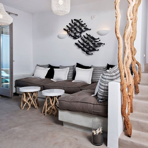 Take a load off in the bright living room, which marries seaside character with minimalism
