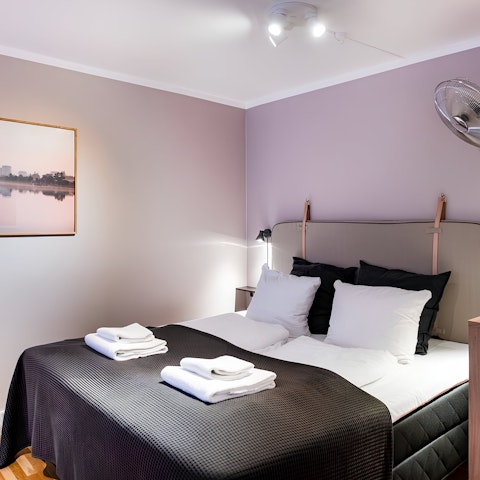 Enjoy a peaceful night's sleep in the calming bedroom