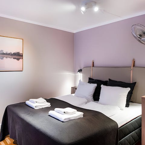 Enjoy a peaceful night's sleep in the calming bedroom