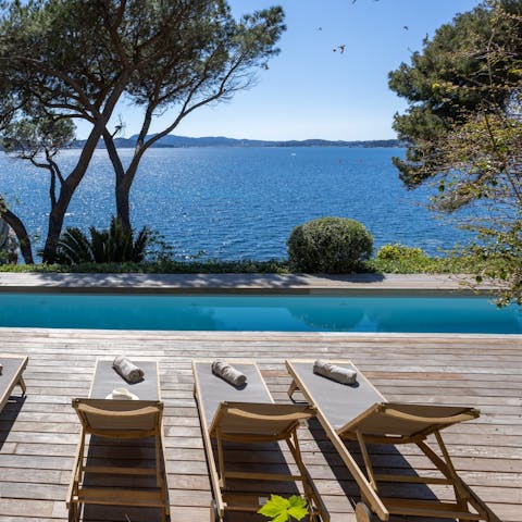 Swim and sunbathe by the private pool