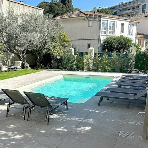 Swim laps or settle in for sundowners by the pool