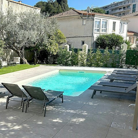 Swim laps or settle in for sundowners by the pool