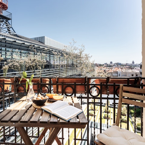 Sip a glass of wine on the sun-kissed balcony
