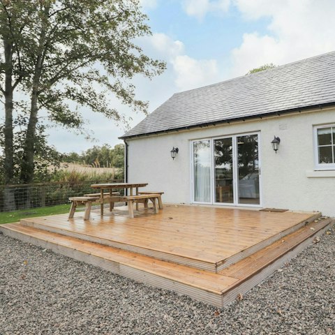 Enjoy a quiet moment surrounded by farmland on the patio