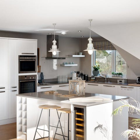 Socialise with your group while prepping a meal in the sleek chef's kitchen