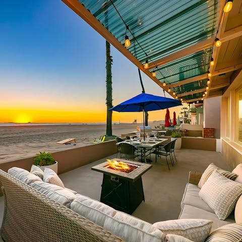 Warm your toes by the firepit after sundown