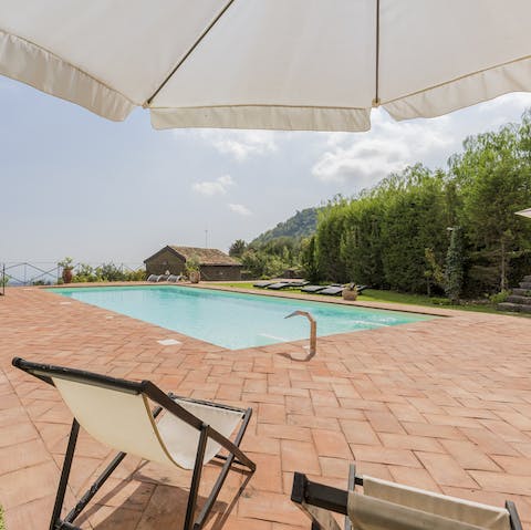 Sit back on deck chairs and sun loungers to watch the sunset after a busy day