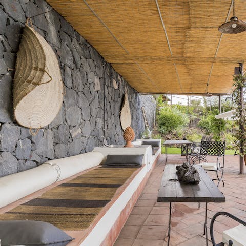 Sit in the shade of the covered terrace and enjoy drinks and home-cooked meals alfresco