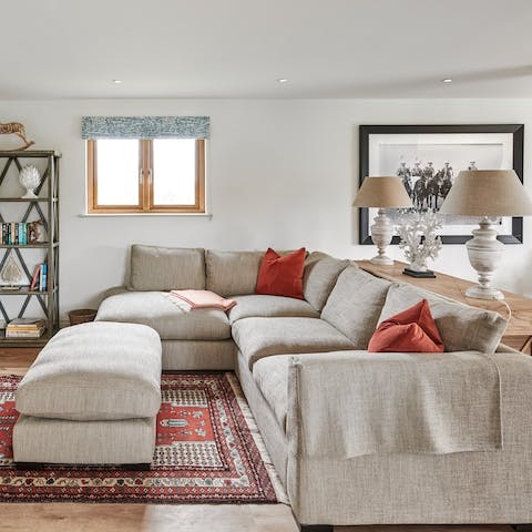 Relax with a glass of wine on the cosy sofas