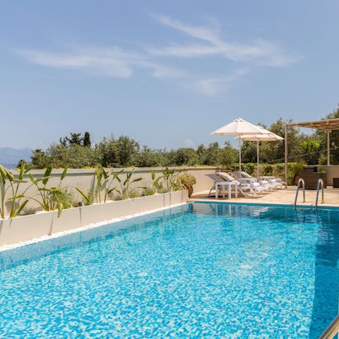 Dive into the glistening pool for a refreshing swim