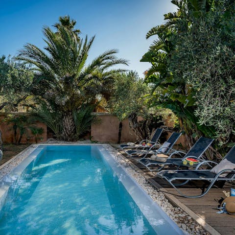 Find peace and relaxation while lounging by the pool