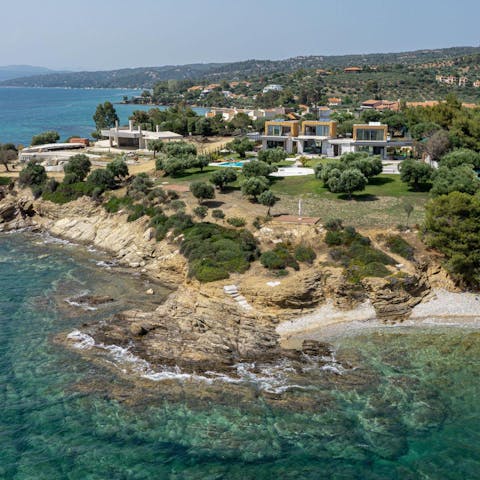 Wander to the edge of the villa's garden to discover a fifteen metre-long rocky beach