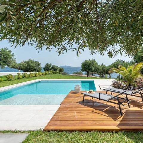 Splash about in the home's private swimming pool and dry off on a sun bed