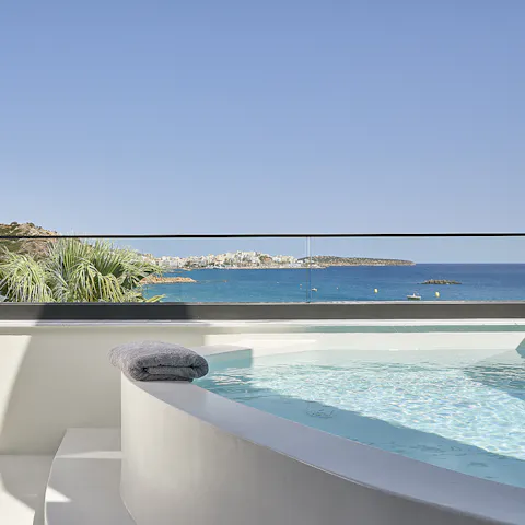 Relax in the Jacuzzi while taking in stunning sea views