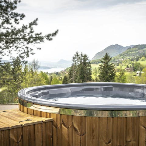 Admire stunning Lake Annecy views from the hot tub