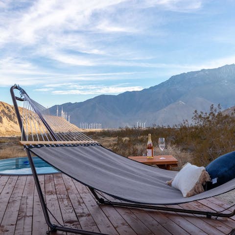 Get cosy on the hammock as you catch up on your favourite podcast with a cold beer