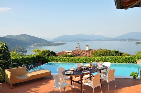 Dine alfresco beside the pool with Lake Maggiore stretching ahead