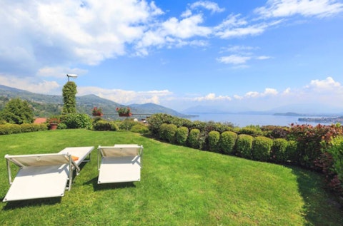 Stretch out on the lawn as Lake Maggiore shimmers below