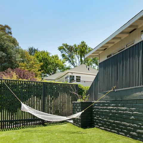 Kick back in the hammock above the immaculate lawn